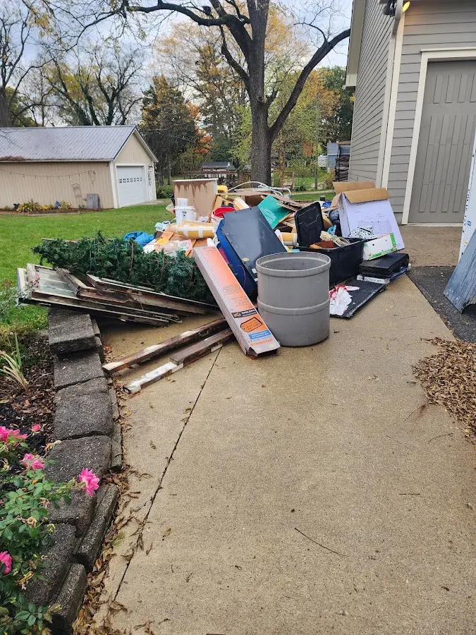 Dumpster being loaded with debris for 30 Yard Dumpster Rental in Gresham